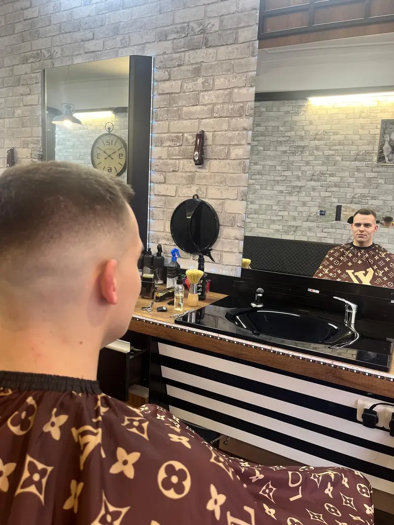 Client checking his fade in the mirror